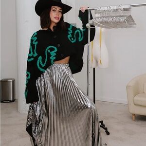 Dressed in Lala Silver Pleated Skirt. NWOT. Never worn.